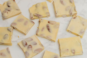 Creamy white chocolate almond bark, hand-poured in-store.